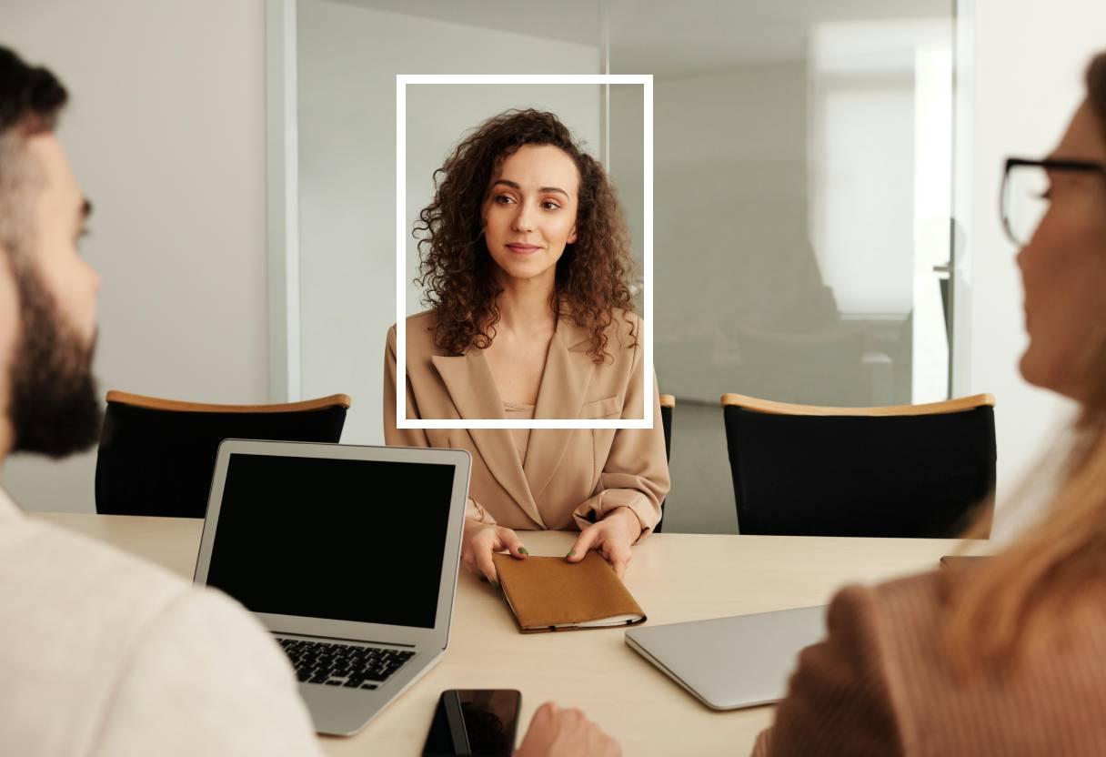 Two recruiters talking to an applicant during a job interview